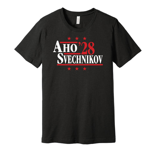 Carolina Hurricanes retro political campaign parody black t-shirt featuring Sebastian Aho and Andrei Svechnikov '28, designed in a vintage election style by Hyper Than Hype Shirts.