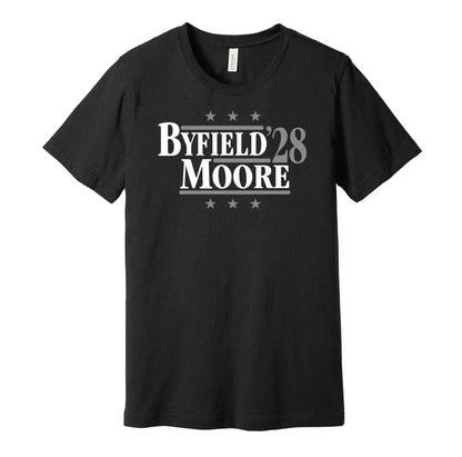 Los Angeles Kings retro political campaign parody black t-shirt featuring Quinton Byfield and Trevor Moore '28, designed in a vintage election style by Hyper Than Hype Shirts.