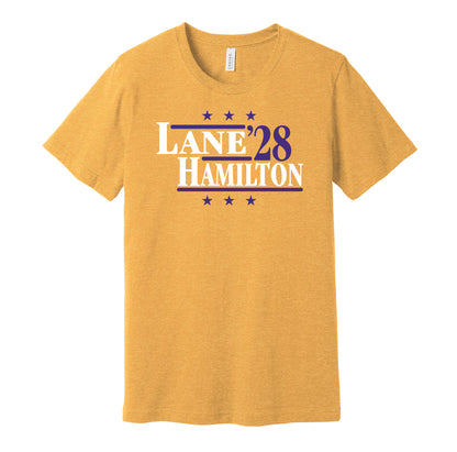 Baltimore Ravens retro political campaign parody gold t-shirt featuring Ja'Kobi Lane and Kyle Hamilton '28, designed in a vintage election style by Hyper Than Hype Shirts.