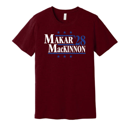 Colorado Avalanche retro political campaign parody burgundy t-shirt featuring Cale Makar and Nathan MacKinnon '28, designed in a vintage election style by Hyper Than Hype Shirts.