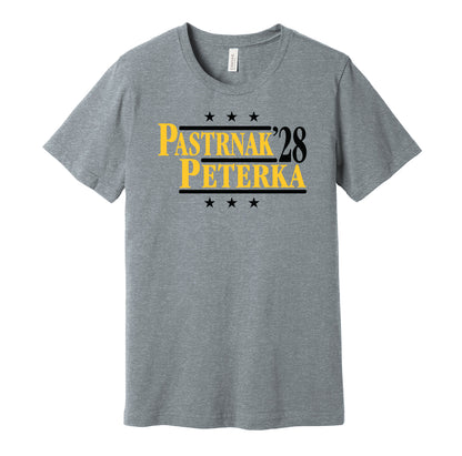 Boston Bruins retro political campaign parody grey t-shirt featuring David Pastrnak and JJ Peterka '28, designed in a vintage election style by Hyper Than Hype Shirts.