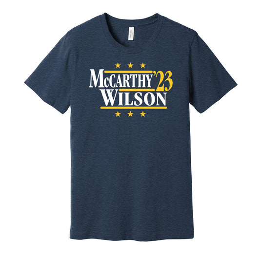 Michigan Wolverines retro political campaign parody navy t-shirt featuring J.J. McCarthy and Roman Wilson '23, designed in a vintage election style by Hyper Than Hype Shirts.