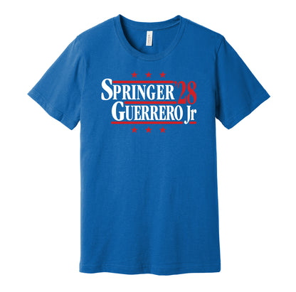 Toronto Blue Jays retro political campaign parody royal blue t-shirt featuring George Springer and Vladimir Guerrero Jr. '28, designed in a vintage election style by Hyper Than Hype Shirts.
