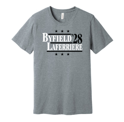 LA Kings retro political campaign parody grey t-shirt featuring Quinton Byfield and Alex Laferriere '28, designed in a vintage election style by Hyper Than Hype Shirts.