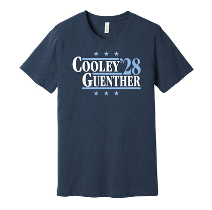 Utah Mammoth retro political campaign parody navy blue t-shirt featuring Logan Cooley and Dylan Guenther '28, designed in a vintage election style by Hyper Than Hype Shirts.