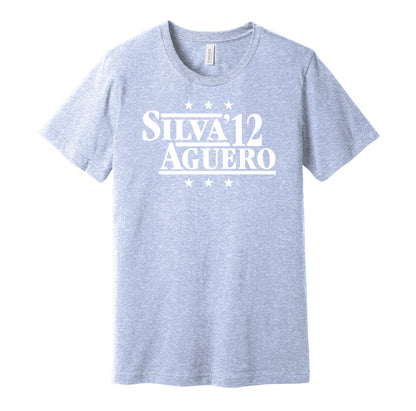 Manchester City retro political campaign parody sky blue t-shirt featuring David Silva and Sergio Aguero '12, designed in a vintage election style by Hyper Than Hype Shirts.