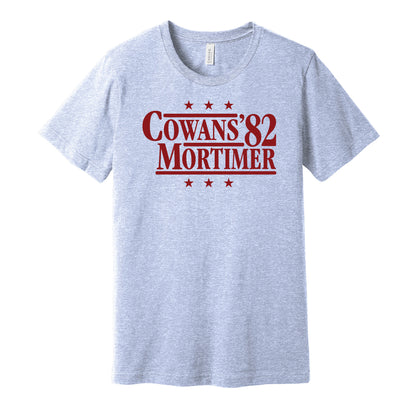 Aston Villa retro political campaign parody blue t-shirt featuring Gordon Cowans and Dennis Mortimer '82, designed in a vintage election style by Hyper Than Hype Shirts.